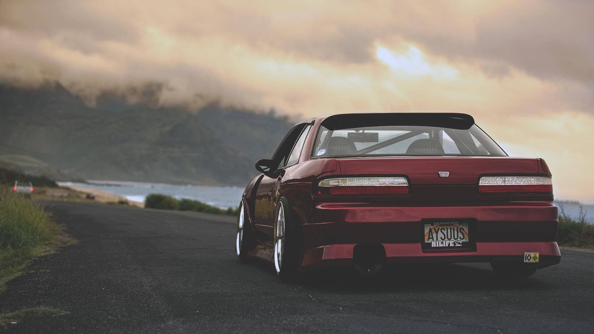 Modern Red Jdm Nissan Silvia S14 Ocean Road Wallpaper