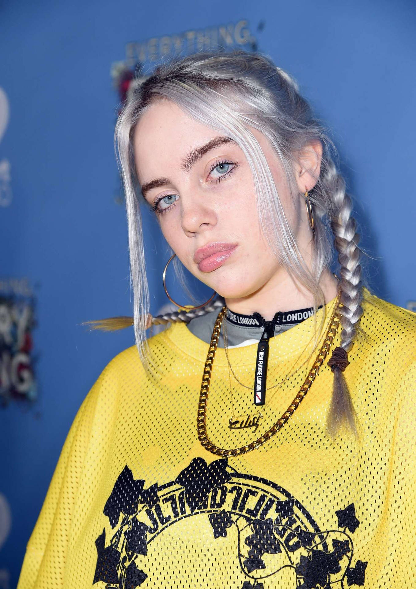 Spectacular Billie Eilish dressed in her signature style Background